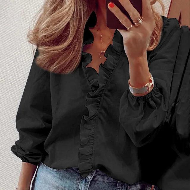 Chique dames blouse met delicate ruches en V-hals. Comfortabele lange mouwen, ideaal voor een elegante kantoorlook.