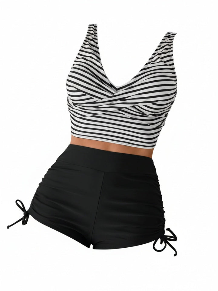 Dames tankini set met gestreepte twist top en zwart high waist broekje.