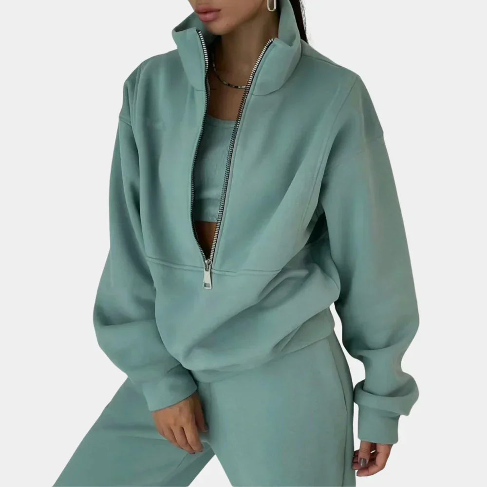"Dames tweedelig trainingspak: elegante sweater, hoge taille broek, comfortabele pasvorm, ideaal voor casual stijl."