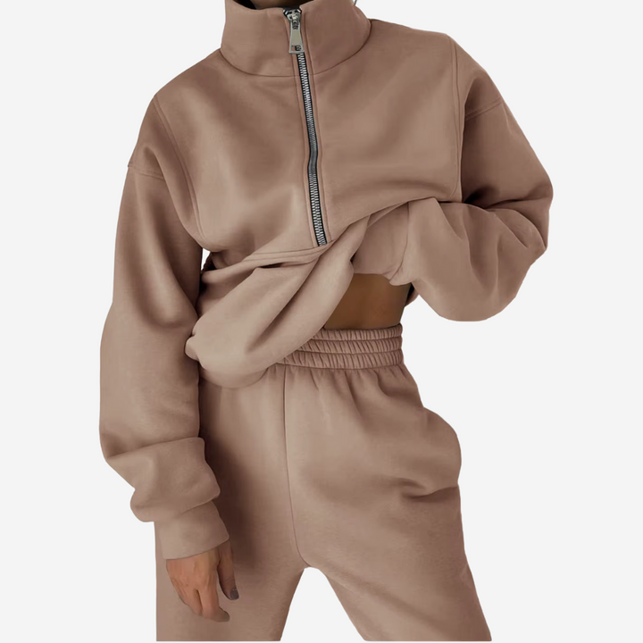 "Dames tweedelig trainingspak: elegante sweater, hoge taille broek, comfortabele pasvorm, ideaal voor casual stijl."
