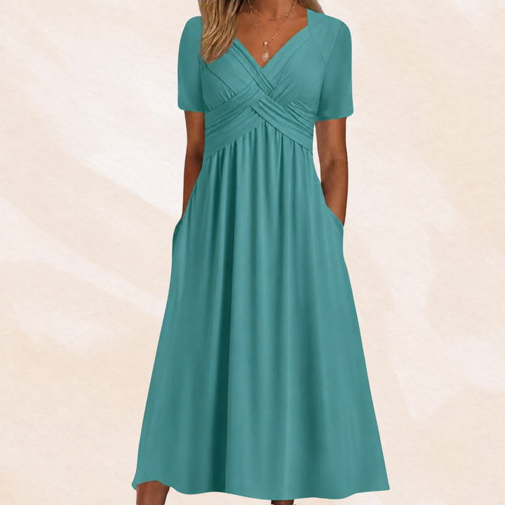 Comfortabele dames midi-jurk met V-hals en A-lijn, ideaal voor casual of feestelijke momenten.