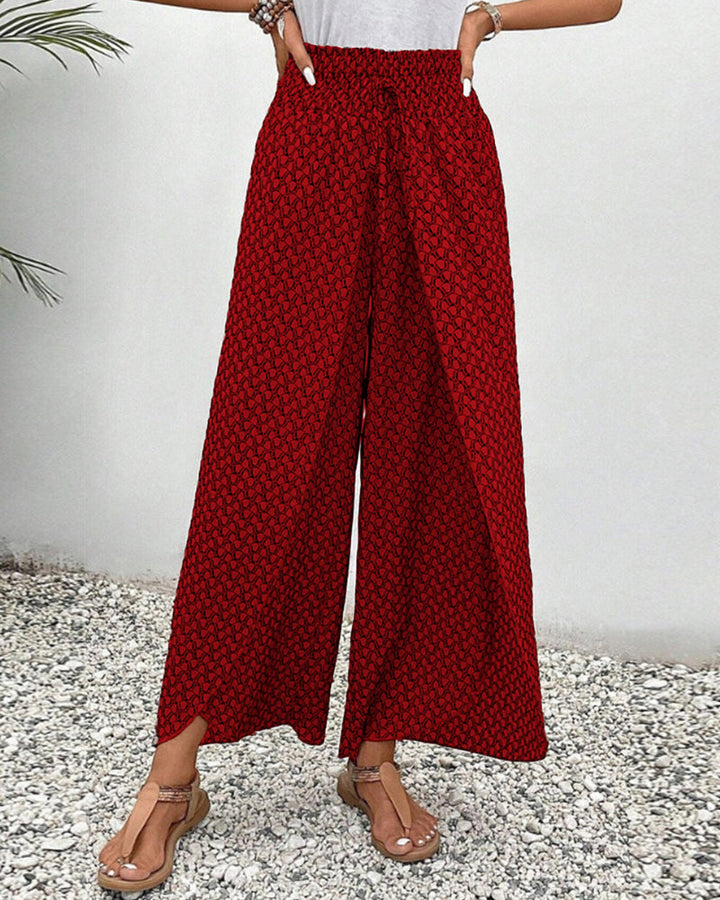 Geometrische patroonbroek voor dames met wijde pijpen, biedt een elegante en casual uitstraling.