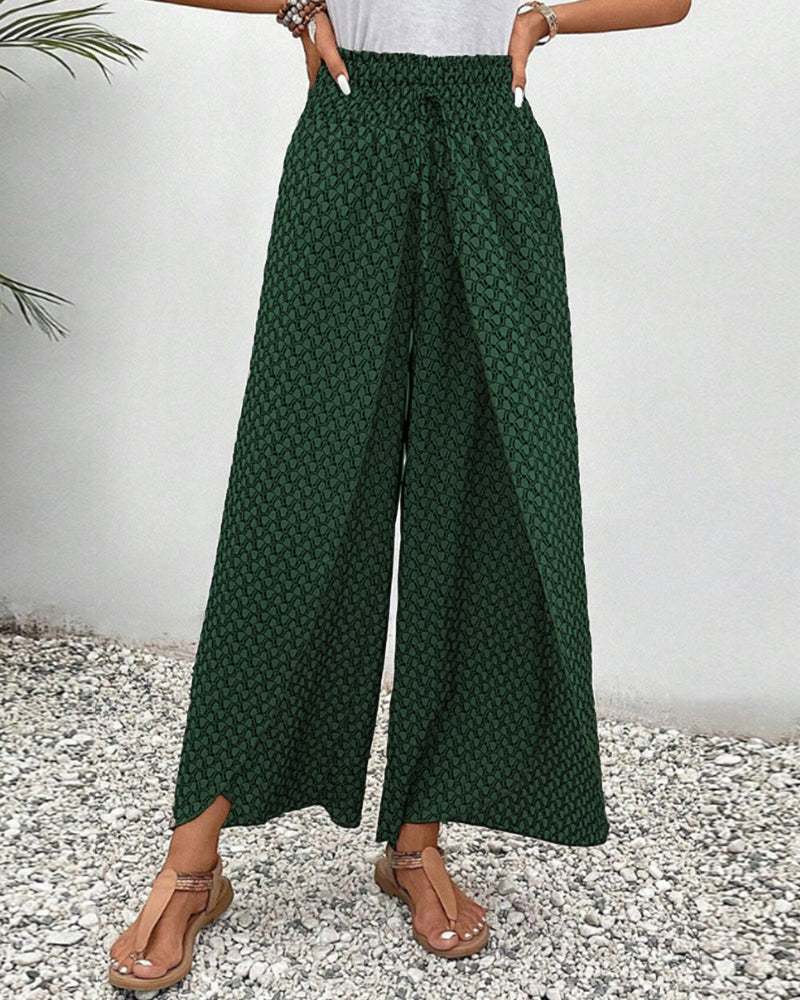 Comfortabele damesbroek met wijde pijpen, elastische taille en modern geometrisch patroon.