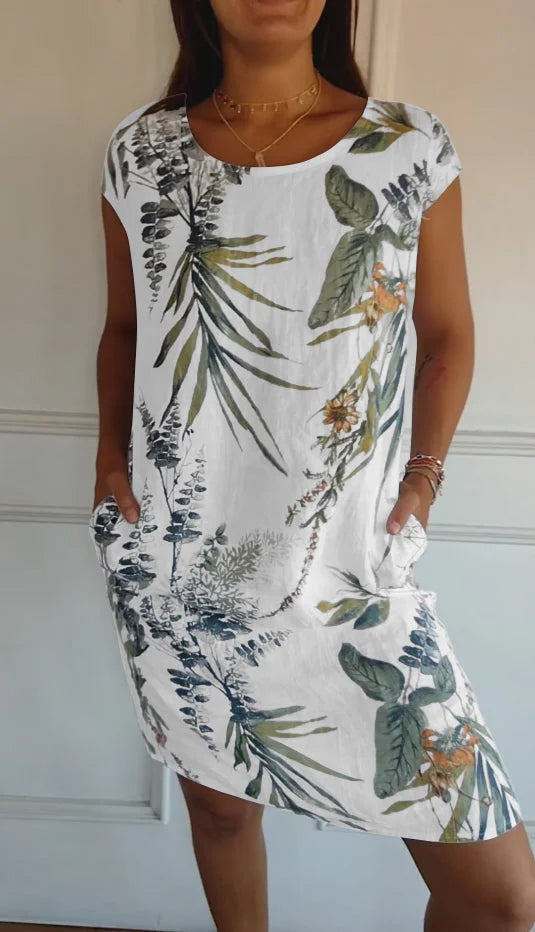 Dames zomerjurk met vrolijke print, ronde hals en luchtige pasvorm. Perfect voor casual dagen.