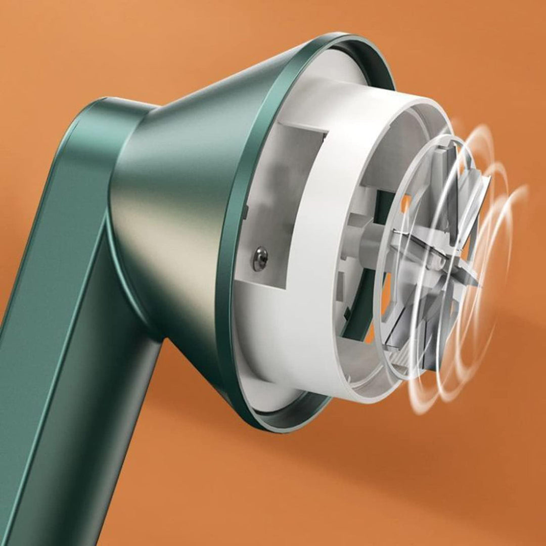 "Draadloze pluizenverwijderaar met groen-wit design, ergonomisch voor kleding en meubels onderhoud, compact en efficiënt."