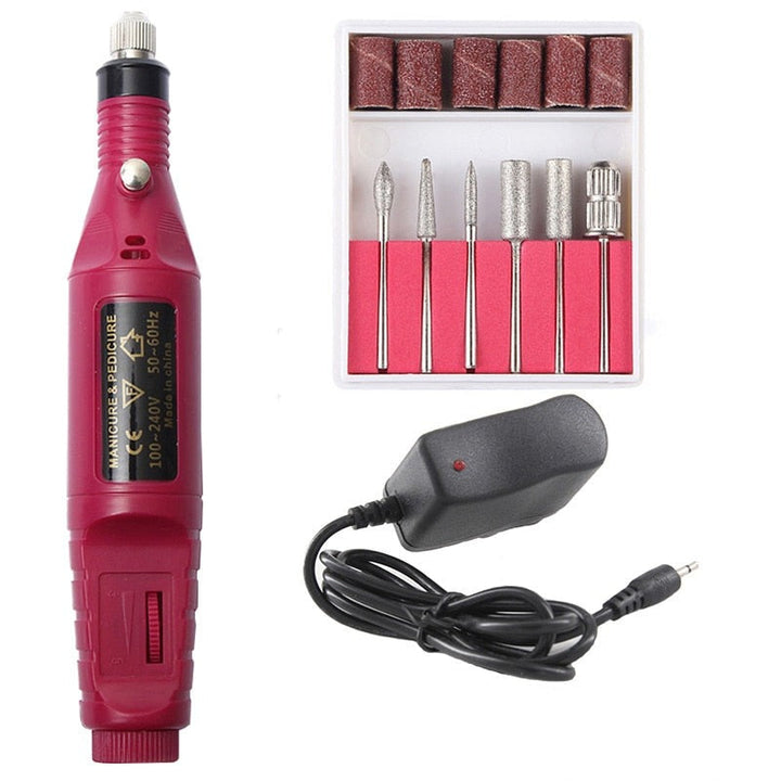"Draagbare 6-in-1 elektrische nagelvijlset voor manicure en pedicure, inclusief 6 opzetstukjes, roze uitvoering."