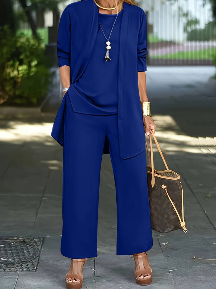 Dames driesterren outfit in grijs: chique vest, bijpassend topje en lange broek voor comfort en stijl.