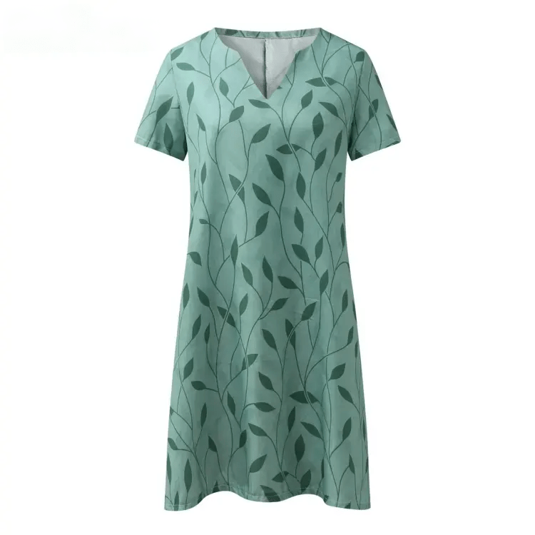 "Elegant bedrukt kleid met V-hals, korte mouwen en unieke print. Ideaal voor zonnige dagen en ontspannen uitjes."