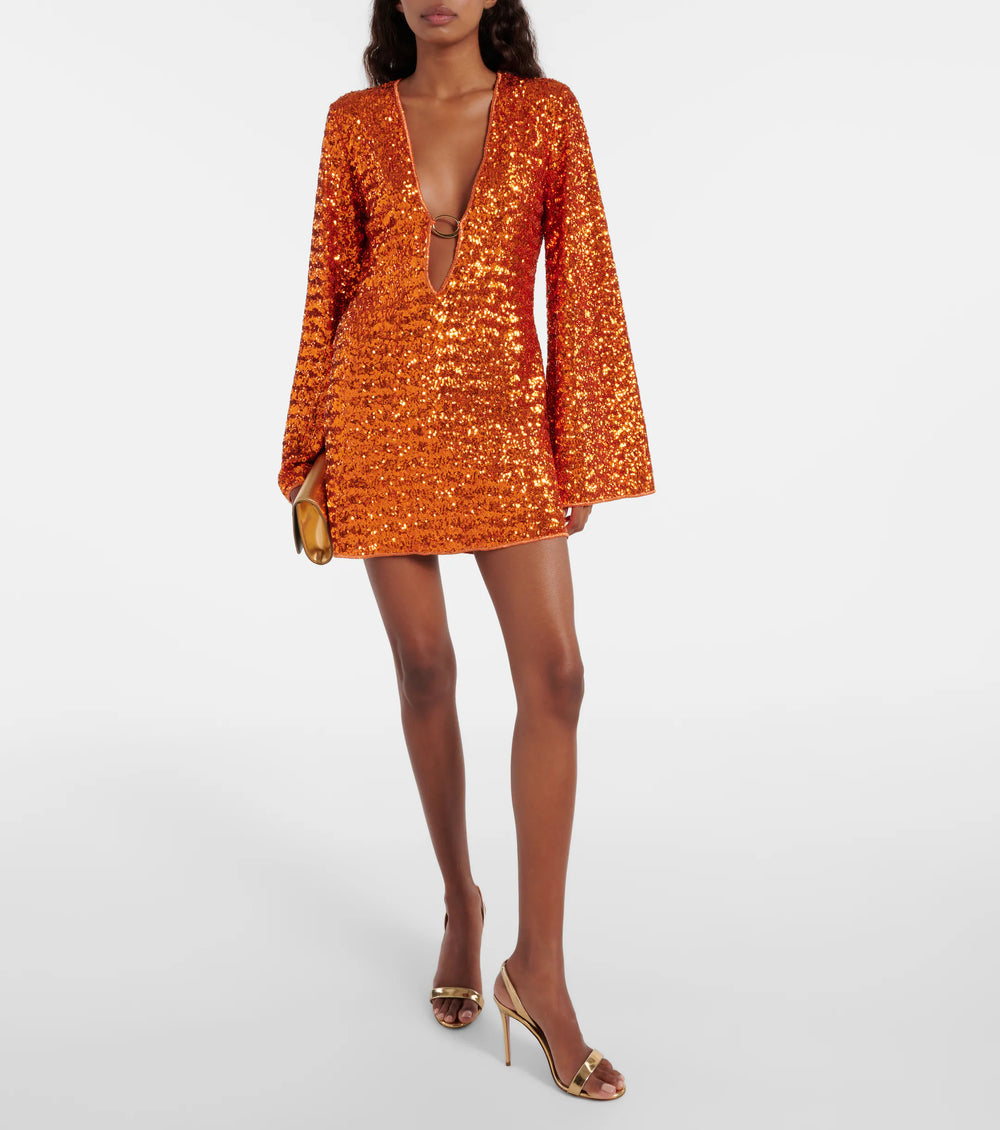 "Elegant mini jurk met pailletten, diepe V-hals en gouden detail. Perfect voor feestjes. Comfortabele stretchy fit."