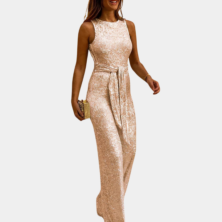 Dames glitter jumpsuit in een feestelijke setting, de ultieme outfit voor een bruiloft of speciale gelegenheid.