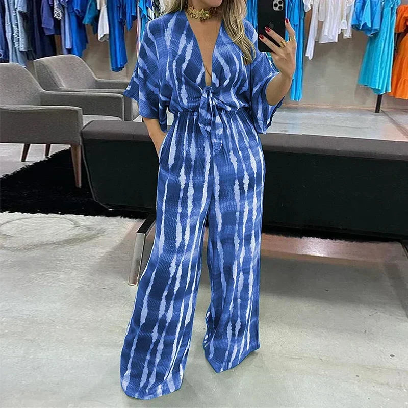 Stijlvolle dames jumpsuit Elyndra, comfortabel voor casual of feestelijke gelegenheden, met trendy V-hals en wijde pijpen.