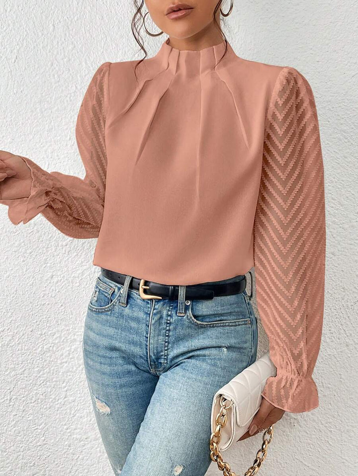 Elegante dames top met opstaande hals en lange mouwen, perfect voor zakelijke of casual gelegenheden.