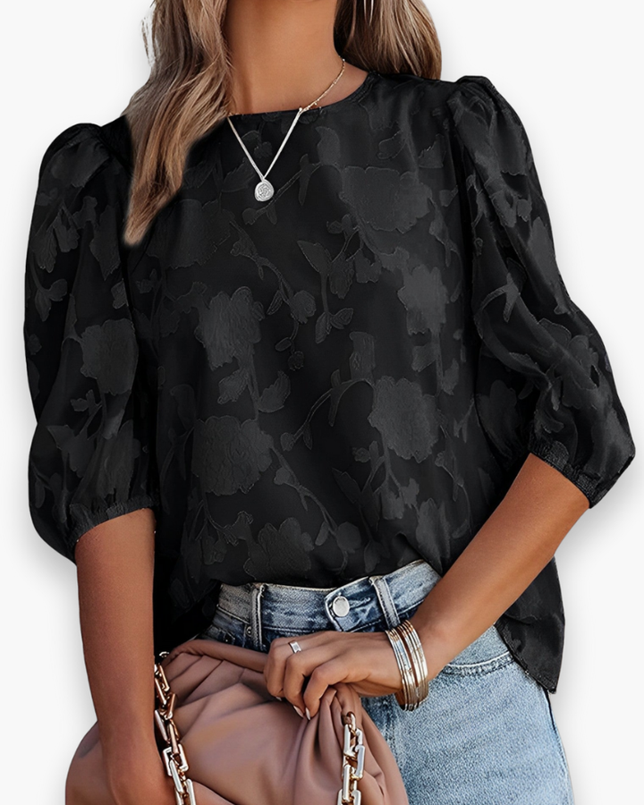 Trendvolle dames top met luchtige pofmouwen, een must-have voor een stijlvolle outfit.
