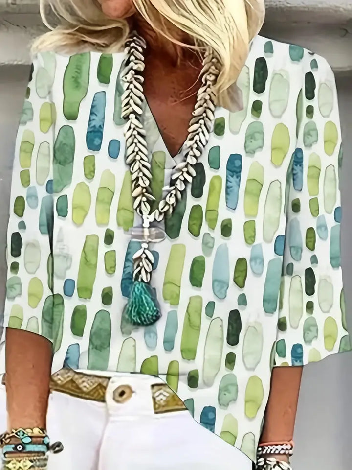 "Elegante geometrische blouse met V-hals, 3-kwart mouwen; moderne print, veelzijdig voor elke gelegenheid."