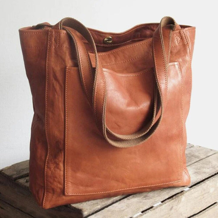 Elegante, leren tas voor dames, chique uitstraling, vlekbestendig interieur, perfecte toevoeging aan elke garderobe.
