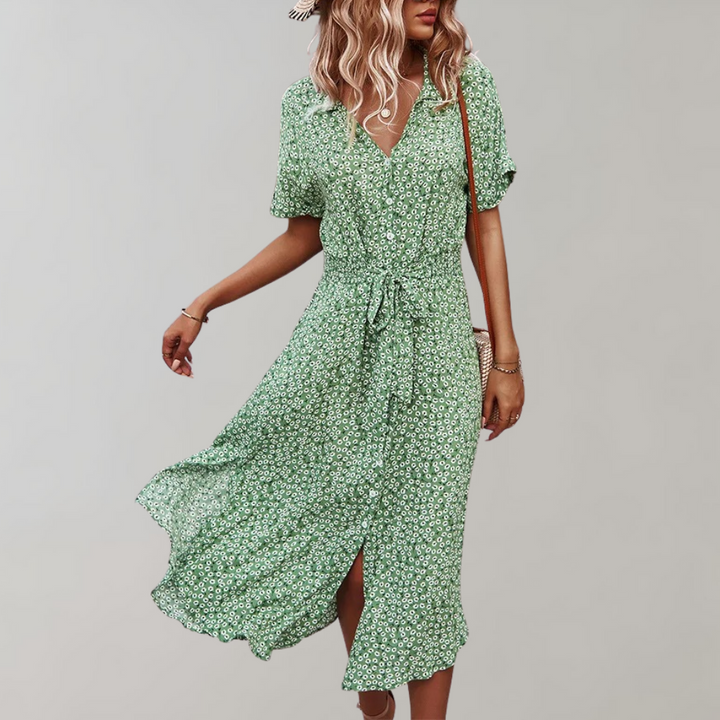 "Elegante midi zomerjurk met bloemenprint en korte mouwen, perfect voor damesmode in zowel casual als formele settings."