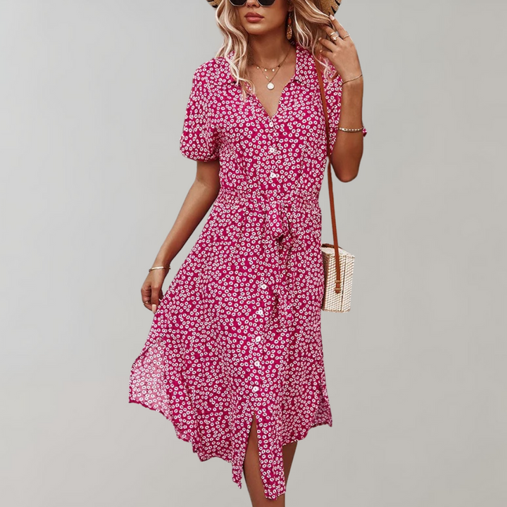 "Elegante midi zomerjurk met bloemenprint en korte mouwen, perfect voor damesmode in zowel casual als formele settings."