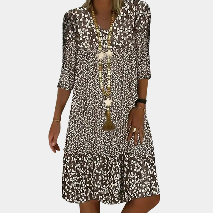 "Elegante midi zomerjurk voor dames met V-hals en korte mouwen, ideaal voor warme dagen in blauw, groen, bruin of rood."
