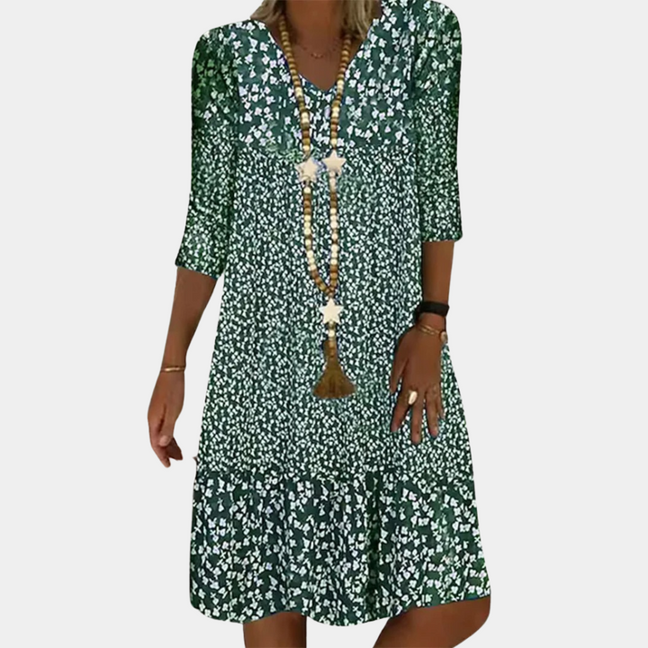 "Elegante midi zomerjurk voor dames met V-hals en korte mouwen, ideaal voor warme dagen in blauw, groen, bruin of rood."