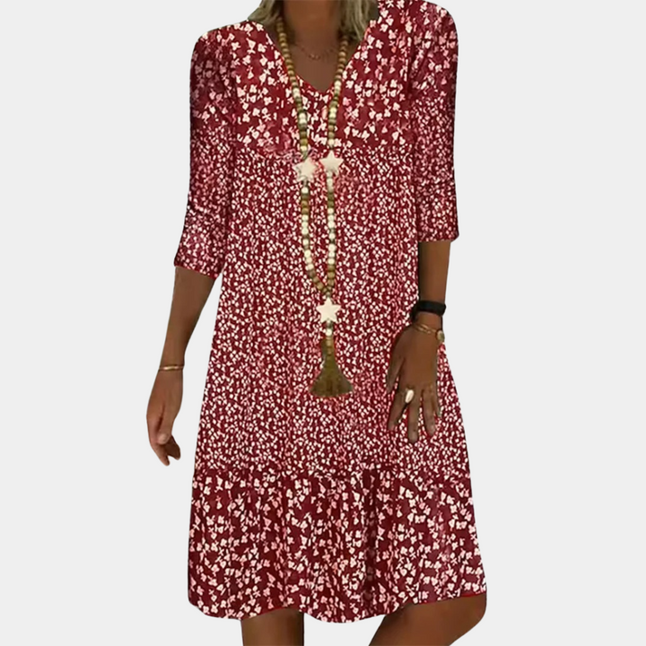 "Elegante midi zomerjurk voor dames met V-hals en korte mouwen, ideaal voor warme dagen in blauw, groen, bruin of rood."