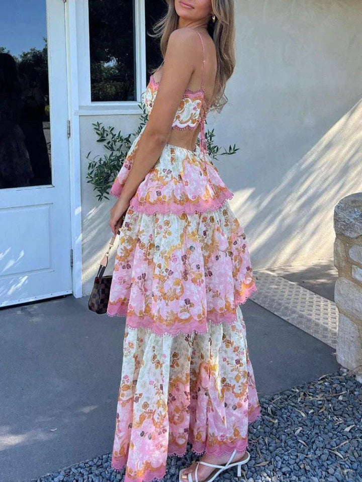 Elegante roze dames maxi-jurk met subtiele ruches en delicate borduursels, perfect voor zomerse gelegenheden.