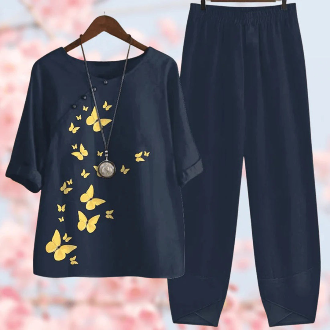 Elegante tweedelige set met vintage bloemenprint, losse top met korte mouwen en high-waist broek, stijlvol en comfortabel.