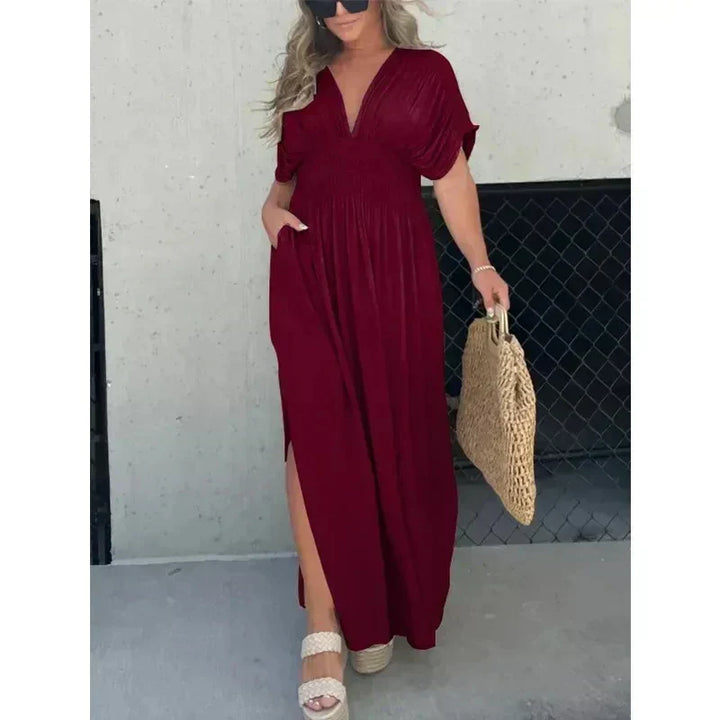 Modieuze dames V-hals zomerjurk, maxi lengte met elegante split. Ideaal voor zomerse dagen en avonden.