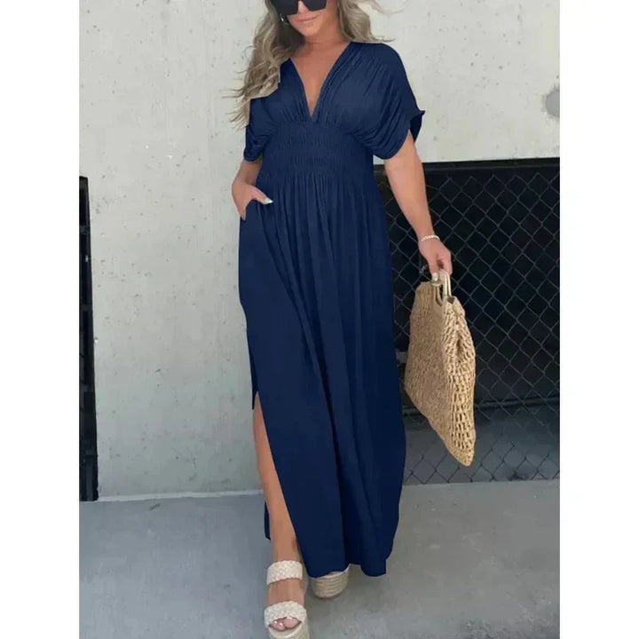 Luchtige strandjurk voor dames; V-hals maxi model met split. Ideaal voor warme dagen en een ontspannen look.