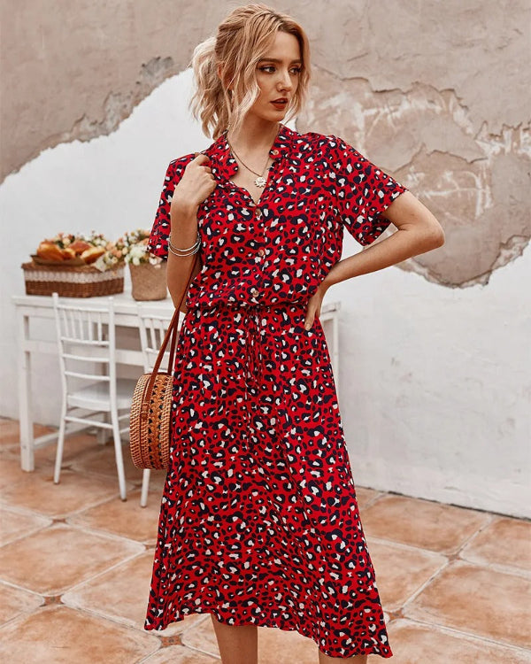 Elegante witte midi-zomerjurk, luchtig materiaal, getailleerde pasvorm voor zomerdagen, ideaal voor diverse gelegenheden.