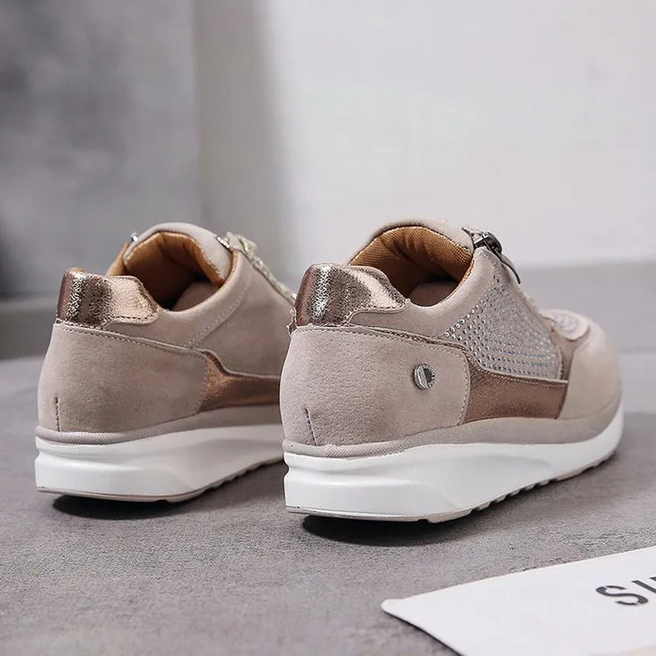 "Ergonomische damessneakers in grijs met ademende materialen, bieden stijl en comfort voor dagelijks gebruik."