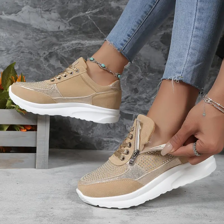 "Ergonomische damessneakers in grijs met ademende materialen, bieden stijl en comfort voor dagelijks gebruik."