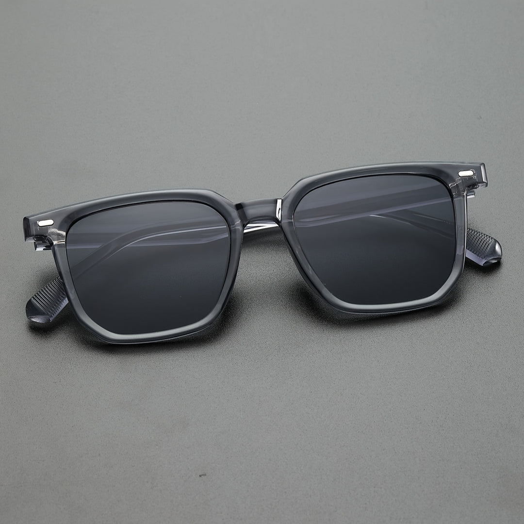 Stijlvolle heren zonnebril, vierkant vintage design. Grijs montuur, perfect voor een casual en trendy look.