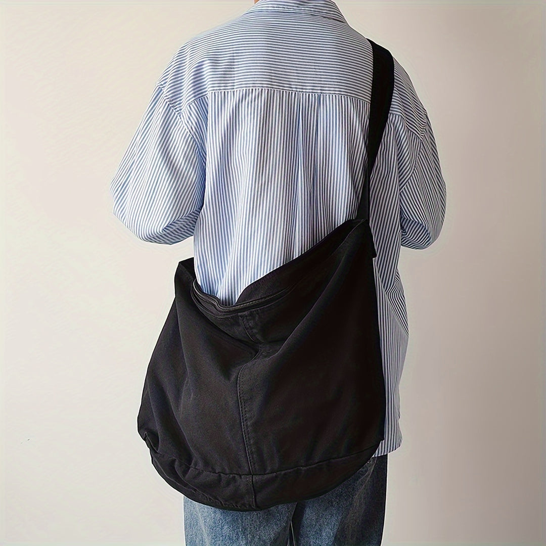 Duurzame heren schoudertas van canvas, stijlvol en veelzijdig voor zowel werk als vrije tijd. Comfortabel te dragen.