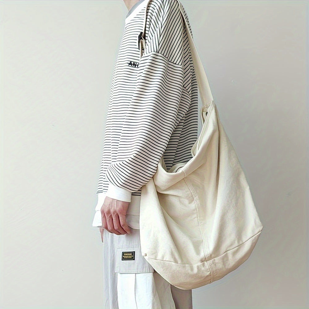 Modieuze heren schoudertas van robuust canvas. Een stijlvol en functioneel accessoire voor de moderne man.