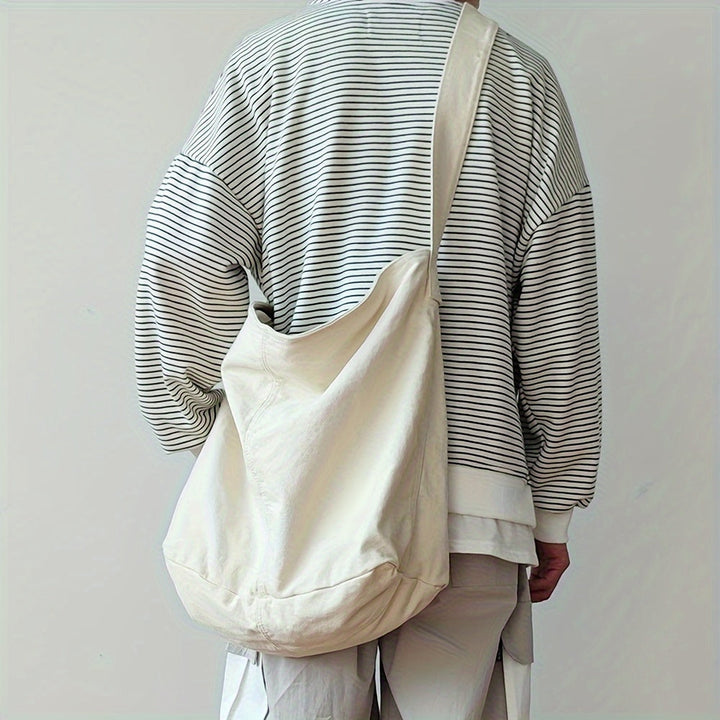 Verstelbare canvas crossbody tas voor heren, ideaal voor dagelijks gebruik, school of kantoor. Stijlvol accessoire.