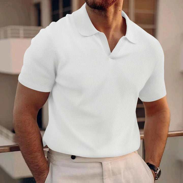 Stijlvolle heren polo met korte mouwen, comfortabel voor de zomer en casual dagen, voorzien van subtiele grid textuur.