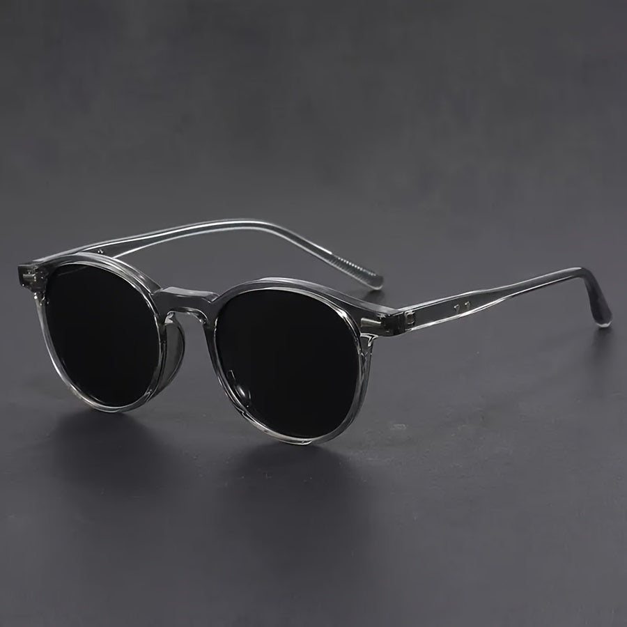 Heren ronde zonnebril in retro stijl, perfect voor een casual of streetstyle look. Biedt essentiële UV bescherming.