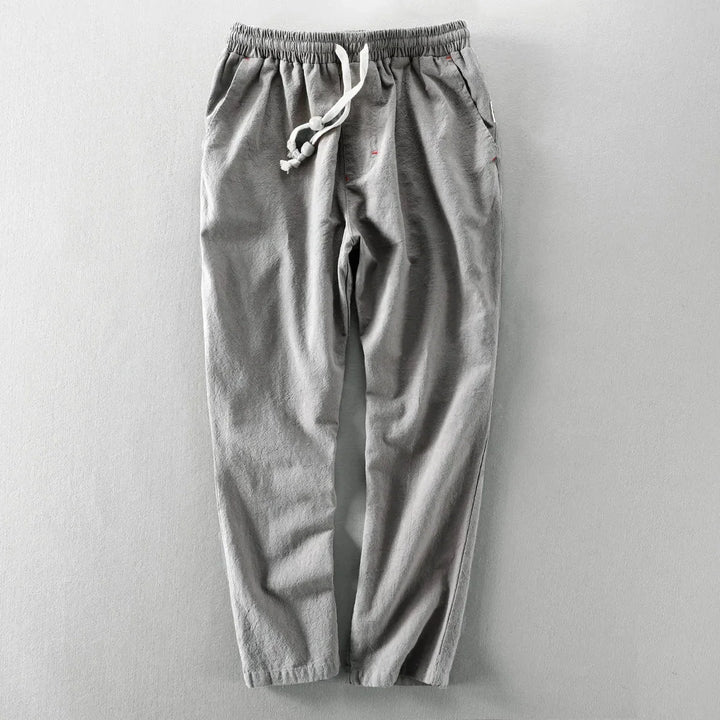 Close-up textuur van de casual herenbroek met rechte pijp, comfortabele elastische taille en trekkoord.