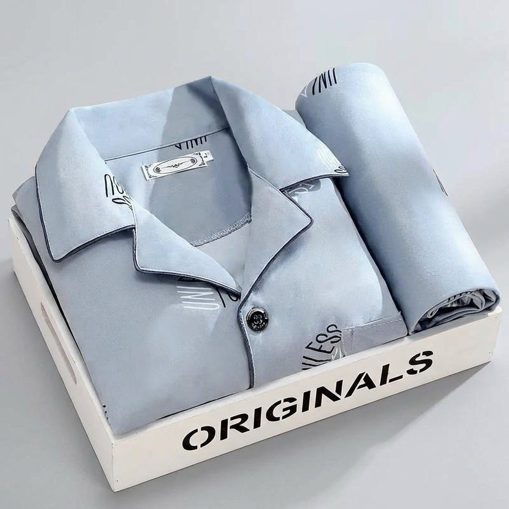 Luxe heren pyjamaset: ademend overhemd met knoopsluiting en bijpassende broek voor rustige nachten.