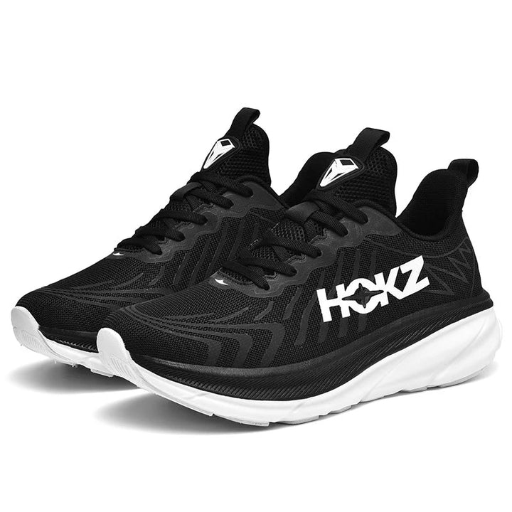 Zwarte unisex hardloopschoenen met witte zool voor training