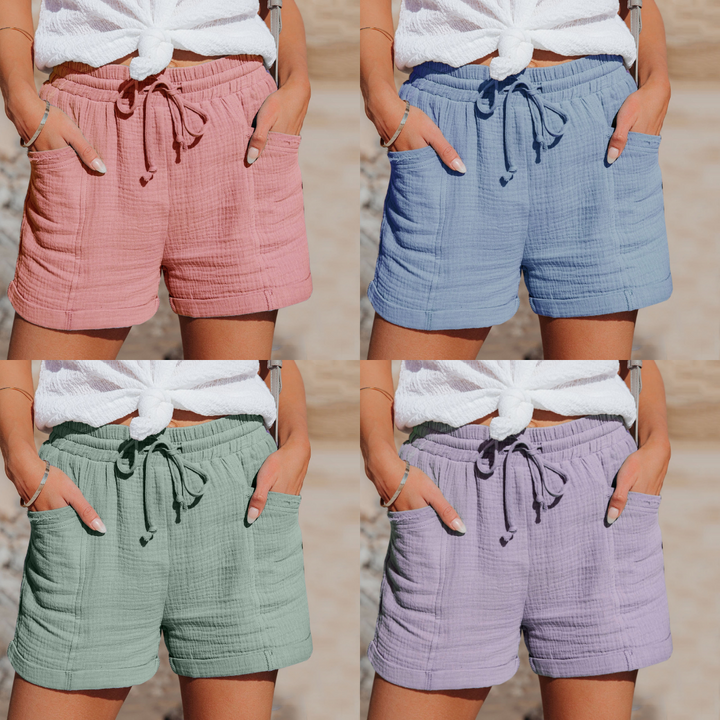 "Korte ademende katoenen dames shorts met verstelbare tailleband en zakken in diverse kleuren, ideaal voor de zomer."
