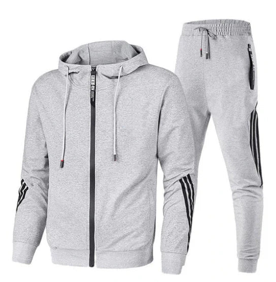 Heren trainingspak van zachte katoenmix. Comfortabel tweedelig pak voor sport en vrije tijd. Stijlvolle sportkleding.