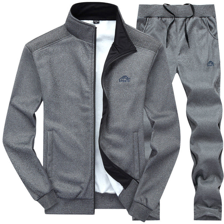 Donkergrijs heren trainingspak, compleet met jasje en bijpassende broek, ideaal voor training of casual gebruik.