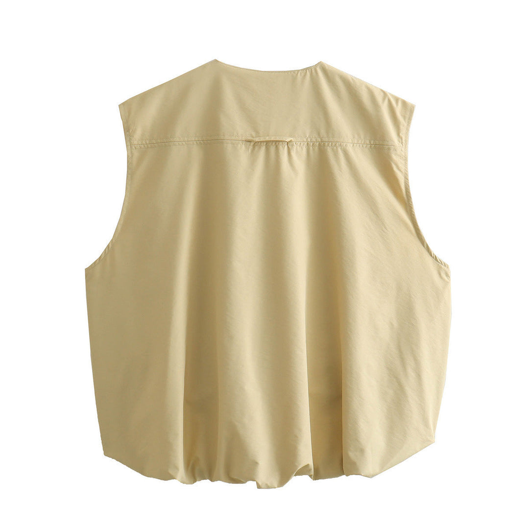 "Lichtgewicht beige mouwloos vest voor dames, met ritssluiting en klepzakken, perfect voor zowel sportieve als casual outfits