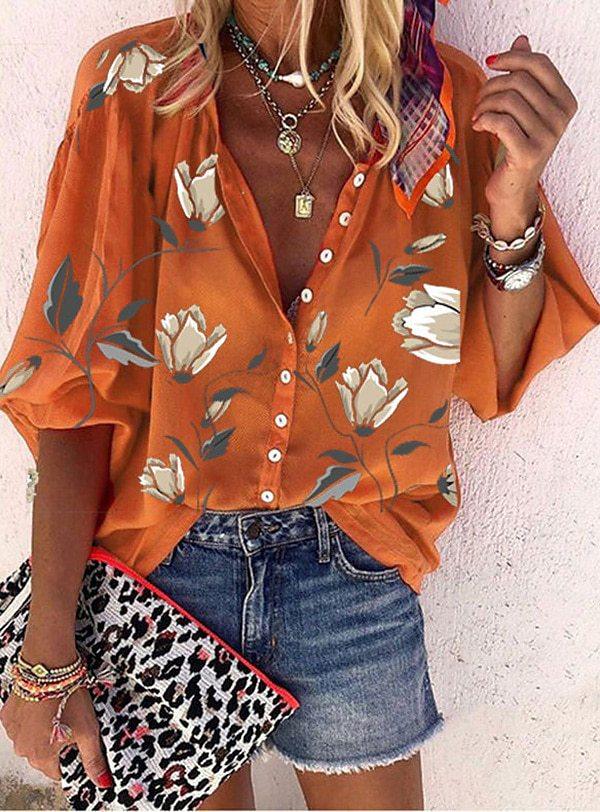 Luchtige boho-chic blouse voor dames met speelse plooien en vrolijke kleuren, perfect voor zomerse dagen.