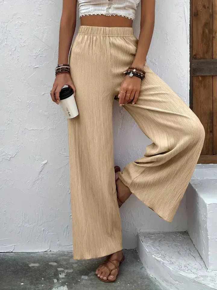 "Luchtige boho-stijl dames palazzo broek met wijde pijpen en elastische tailleband, ideaal voor zomer en casual looks."