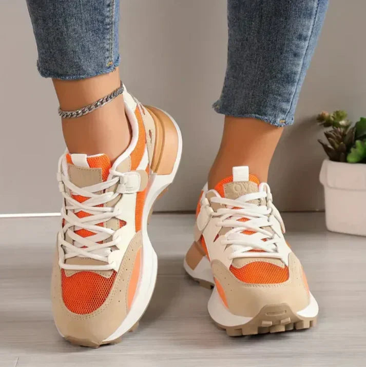 "Modieuze colorblock dames sneakers, chique en comfortabel, met trendy patroon en hoogwaardige materialen in oranje."