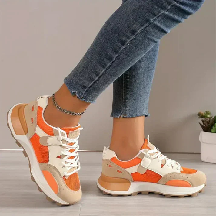 "Modieuze colorblock dames sneakers, chique en comfortabel, met trendy patroon en hoogwaardige materialen in oranje."
