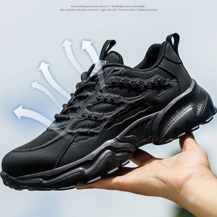 "Onverwoestbare zwarte werksneakers met stalen neus, anti-plet, flexibele zool, ideaal voor bescherming en comfort."