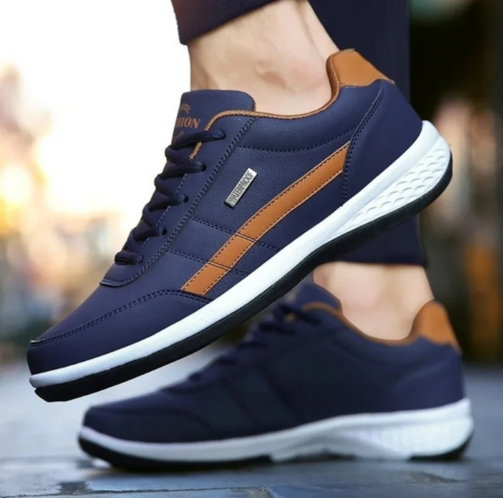"Orthopedische herensneakers, blauwe ademende stof, dempende zool voor comfort en ondersteuning bij dagelijks gebruik."
